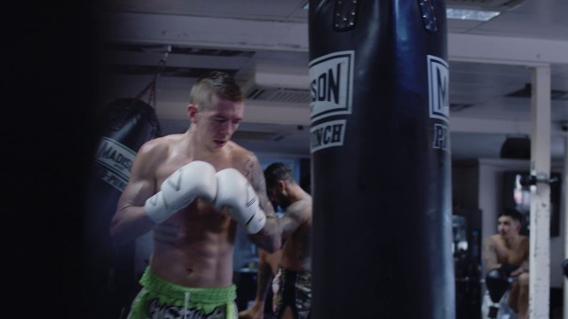 'FITNESS Man Using Punching Bag - ULTRA HD 4K Stock Footage'