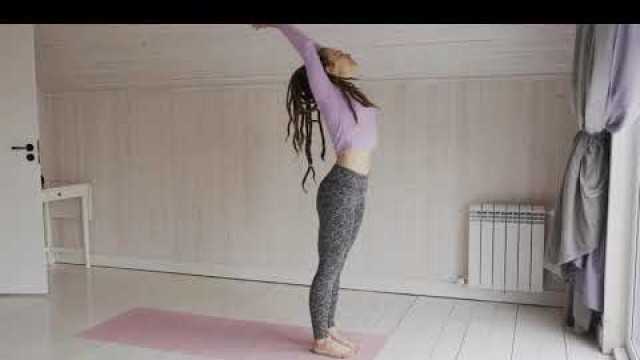 'Fitness:A woman doing a body and mind exercise over a mat on the floor'