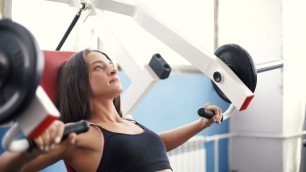 'fitness woman exercising her body in the gym slminingcom'