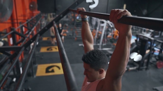 'FITNESS Man Jumping up on Pull Up Bars - ULTRA High Quality Stock Footage'