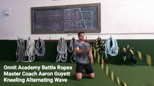 'Kneeling Alternating Waves Battle Ropes Exercise'