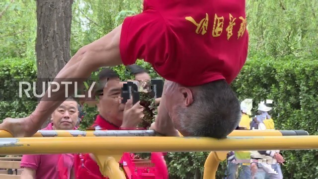 'You spin me right round Beijing - pensioners show off peak fitness and gymnastic skills'
