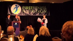 'Presidential Carina Robbins accepts award from first fitness Nutrition'