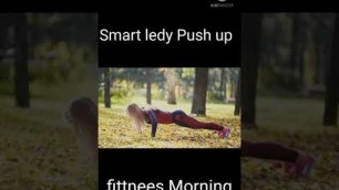 'Fitness woman strength training doing Fit caucasian sporty girl exercising her body - does push-UPS'