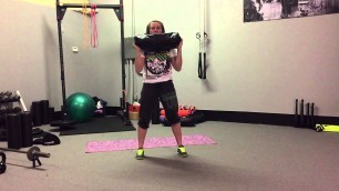 'Sandbag Squat to Press w/Side Grab | Rippel Effect Fitness'